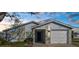 Charming single-story home featuring stone accents, a well-maintained lawn, and an attached single car garage at 13726 Michelle Ave, Hudson, FL 34667