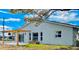Exterior view of a home with a patio featuring a pergola at 13726 Michelle Ave, Hudson, FL 34667