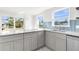 Bright kitchen with granite countertops and canal views at 13726 Michelle Ave, Hudson, FL 34667