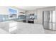 Updated kitchen with stainless appliances, granite countertops, and blue backsplash at 13726 Michelle Ave, Hudson, FL 34667