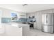 Modern kitchen with stainless steel appliances and an island at 13726 Michelle Ave, Hudson, FL 34667