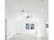 Living space with vaulted ceilings and neutral tile flooring; bright with lots of natural light at 13726 Michelle Ave, Hudson, FL 34667