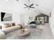 Open-concept living space with modern decor and vaulted ceilings at 13726 Michelle Ave, Hudson, FL 34667