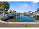 Scenic view of a waterfront canal featuring a boat lift and easy access to open water at 13726 Michelle Ave, Hudson, FL 34667