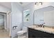 Bright bathroom featuring granite countertop, a mirror with modern lights, and a toilet at 14251 Mansfield Rd, Spring Hill, FL 34609