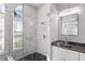 Bright bathroom featuring frameless shower with stone pebble floor, and granite countertop with a modern rectangular sink at 14251 Mansfield Rd, Spring Hill, FL 34609