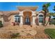 Welcoming home with arched entryway, double front doors, and professionally landscaped front yard at 14251 Mansfield Rd, Spring Hill, FL 34609