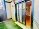 Backyard with a sliding glass door and synthetic turf at 14736 Norwood Oaks Dr # 103, Tampa, FL 33613