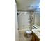 Bathroom with a shower-tub combo and white tile at 14736 Norwood Oaks Dr # 103, Tampa, FL 33613