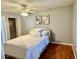 Bedroom with neutral tones, wood floors, ceiling fan, and closet at 14736 Norwood Oaks Dr # 103, Tampa, FL 33613