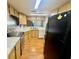 Well-lit kitchen featuring sleek appliances, ample counter space, and wooden cabinetry with stylish accents at 14736 Norwood Oaks Dr # 103, Tampa, FL 33613