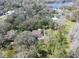 Aerial view of the property with a lake in the background at 14821 Sassandra Dr, Odessa, FL 33556