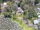 Aerial view showcasing the property's unique setting next to a pond and lake at 14821 Sassandra Dr, Odessa, FL 33556