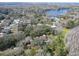 Aerial view showcasing the property's prime location near a beautiful lake and neighborhood at 14821 Sassandra Dr, Odessa, FL 33556