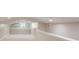 Finished attic space with white walls, carpet and two doors at 14821 Sassandra Dr, Odessa, FL 33556