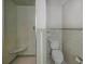 Tiled bathroom featuring a walk-in shower and toilet at 14821 Sassandra Dr, Odessa, FL 33556