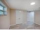 Spacious bedroom with light wood floors and a double door closet at 14821 Sassandra Dr, Odessa, FL 33556