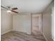Bedroom with light wood floors and a ceiling fan at 14821 Sassandra Dr, Odessa, FL 33556
