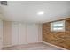 Bedroom featuring a brick accent wall, and a closet, perfect for storage and personalization at 14821 Sassandra Dr, Odessa, FL 33556