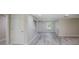Open living room featuring sleek floors, neutral paint, and abundant natural light, ready for personalized touches at 14821 Sassandra Dr, Odessa, FL 33556