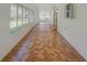 Sunroom with wall-to-wall windows that offer views of the yard at 14821 Sassandra Dr, Odessa, FL 33556