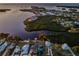 Stunning aerial view showcases waterfront homes nestled along lush mangroves and tranquil waters at 1616 Sea Breeze Dr, Tarpon Springs, FL 34689