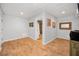 Finished basement with tile floors and an adjacent bathroom and shower room at 1616 Sea Breeze Dr, Tarpon Springs, FL 34689