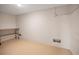 Spacious basement room with concrete walls, metal shelving unit and epoxy flooring, ready for customization at 1616 Sea Breeze Dr, Tarpon Springs, FL 34689