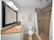Modern bathroom with granite countertops and tiled shower at 1616 Sea Breeze Dr, Tarpon Springs, FL 34689