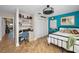 Comfortable bedroom with stylish decor, dedicated workspace, and ample natural light at 1616 Sea Breeze Dr, Tarpon Springs, FL 34689