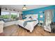 Bright bedroom with a window seat, coastal decor, and an inviting atmosphere at 1616 Sea Breeze Dr, Tarpon Springs, FL 34689