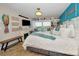 Comfortable bedroom with a cozy fireplace, window seat, and beautiful water view at 1616 Sea Breeze Dr, Tarpon Springs, FL 34689