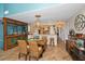 Open floor plan with view of the living room and kitchen area, coastal decor, and hardwood floors at 1616 Sea Breeze Dr, Tarpon Springs, FL 34689