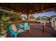 Cozy waterfront dock features comfortable seating, offering the perfect spot to relax and enjoy the view at 1616 Sea Breeze Dr, Tarpon Springs, FL 34689
