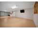 Spacious garage with epoxy floors and storage, providing ample space for vehicles and projects at 1616 Sea Breeze Dr, Tarpon Springs, FL 34689