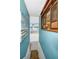 Hallway with an artful aesthetic, leading to the basement at 1616 Sea Breeze Dr, Tarpon Springs, FL 34689