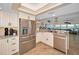 Well-appointed kitchen with stainless steel appliances, granite counters and an open layout at 1616 Sea Breeze Dr, Tarpon Springs, FL 34689