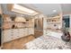 Modern kitchen with granite countertops, stainless steel appliances, tile backsplash, and custom cabinets at 1616 Sea Breeze Dr, Tarpon Springs, FL 34689