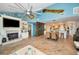 Open concept living area with a fireplace, dining area, and unique coastal decor at 1616 Sea Breeze Dr, Tarpon Springs, FL 34689