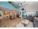 Open-concept floor plan with a cozy living room, dining area, and waterfront views at 1616 Sea Breeze Dr, Tarpon Springs, FL 34689