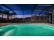 Sparkling pool with a screened-in lanai, perfect for outdoor entertaining at 1616 Sea Breeze Dr, Tarpon Springs, FL 34689