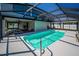 Enclosed pool offering sun and shade with room for lounging and a view at 1616 Sea Breeze Dr, Tarpon Springs, FL 34689
