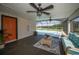 Stylish lanai with cozy seating, dual fans, and pool access at 1616 Sea Breeze Dr, Tarpon Springs, FL 34689