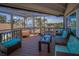 Relaxing screened-in porch with comfortable seating and scenic water views at 1616 Sea Breeze Dr, Tarpon Springs, FL 34689