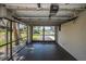 Screened patio area with view to outside driveway at 1616 Sea Breeze Dr, Tarpon Springs, FL 34689