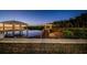 Waterfront home featuring a private dock perfect for relaxation at twilight at 1616 Sea Breeze Dr, Tarpon Springs, FL 34689