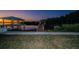 Waterfront property featuring a backyard with a dock and boat lift access to a beautiful waterway at 1616 Sea Breeze Dr, Tarpon Springs, FL 34689