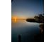 Stunning waterfront view with a sunset and calm water, offering a serene and picturesque setting at 1616 Sea Breeze Dr, Tarpon Springs, FL 34689