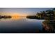 Stunning sunset over the water creating a colorful sky and peaceful scene at 1616 Sea Breeze Dr, Tarpon Springs, FL 34689