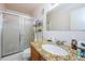 Cozy bathroom featuring vanity with granite countertop and a glass-enclosed shower at 2261 Swedish Dr # 33&35, Clearwater, FL 33763